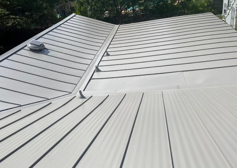 Solar attic fan installed on a metal roof for Roof Ventilation in Dublin